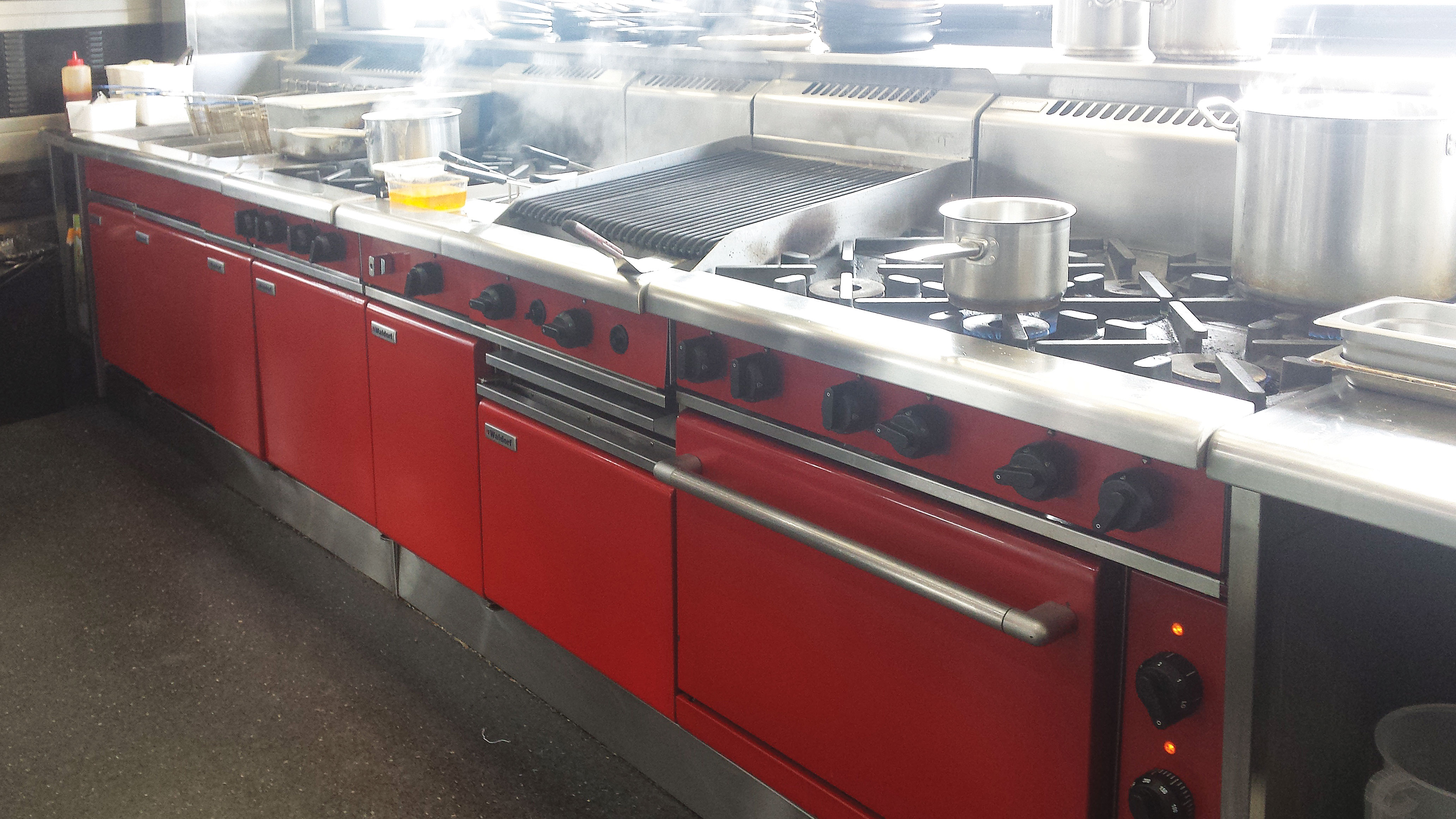 The kitchen was installed with a Waldorf Bold chili red pasta cooker, cooktop, oven range, chargrill and two fryers.